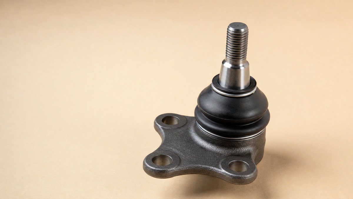 Ball joint with threaded stud, tapered housing and rubber dust boot